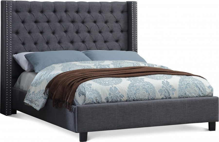Sophisticated Grey Upholstered Wingback Bed with Button Tufting and Nailhead Trim